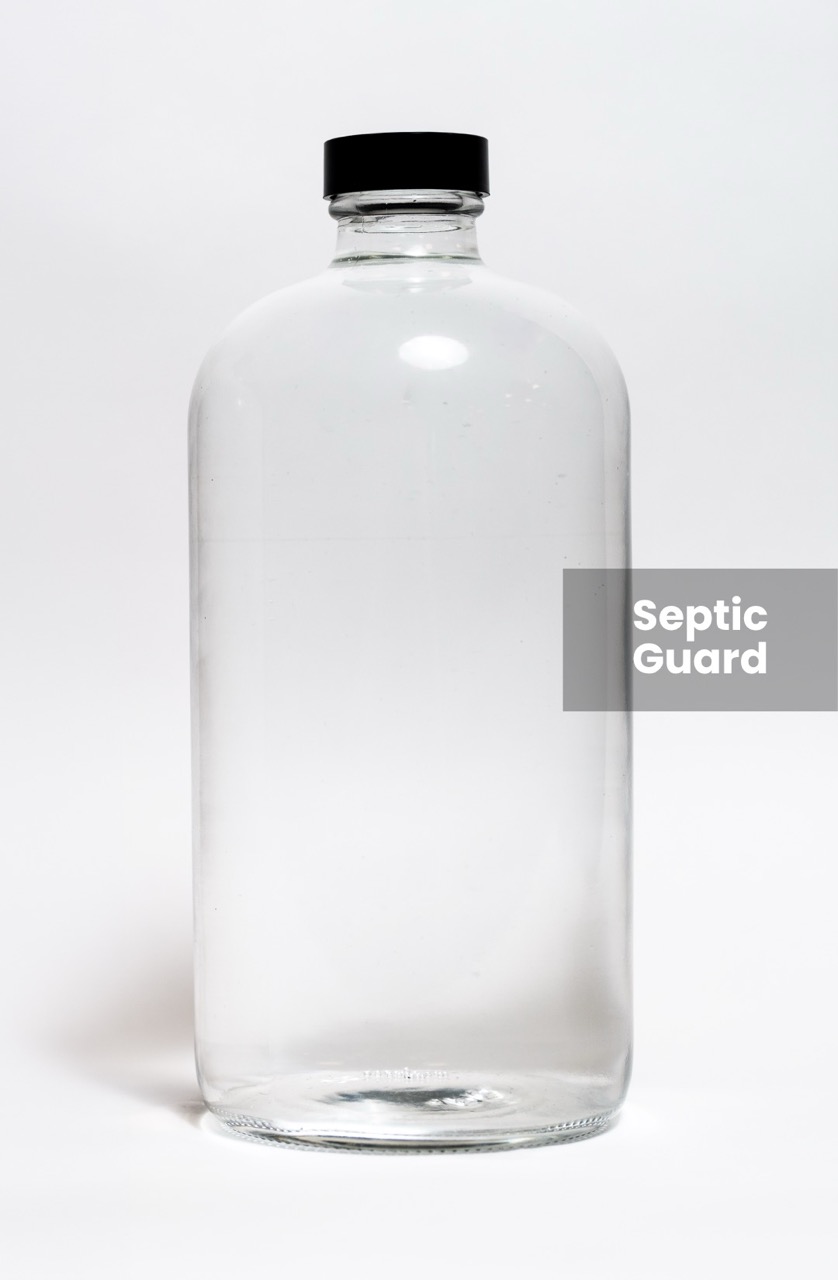 Jar of clean water filtered with CLEANR's Septic Guard